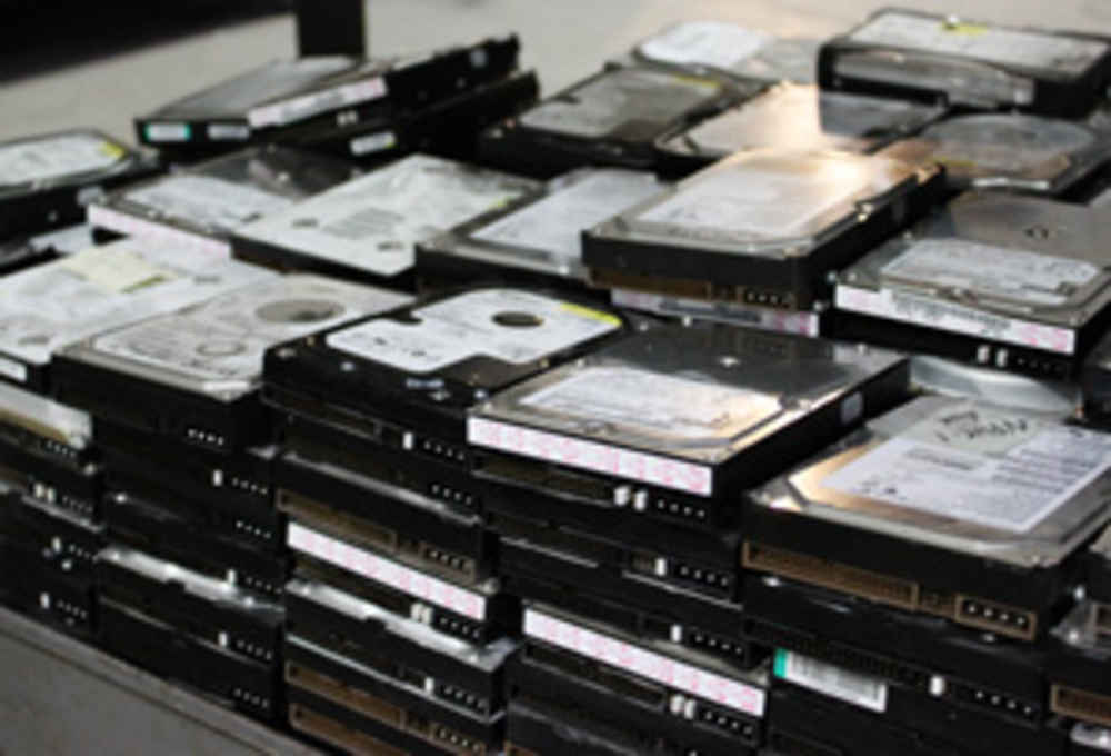 Stack of hard drives being sent for wiping